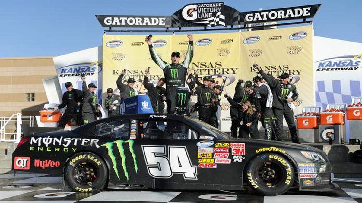 
Kyle Bush celebrated in victory lane with his crew after winning the 13th annual Kansas Lottery 300 on Saturday at Kansas Speedway.
