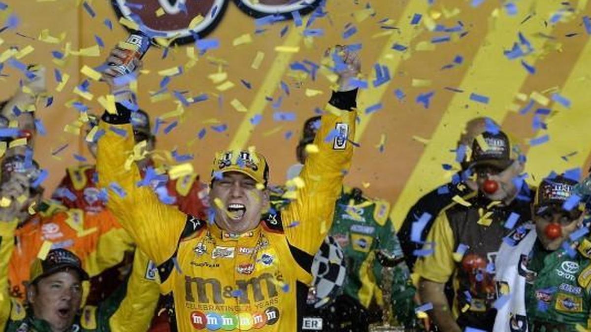 Kyle Busch and his team celebrated Busch’s win at the Go Bowling 400 Sprint Cup Series race Saturday at Kansas Speedway.