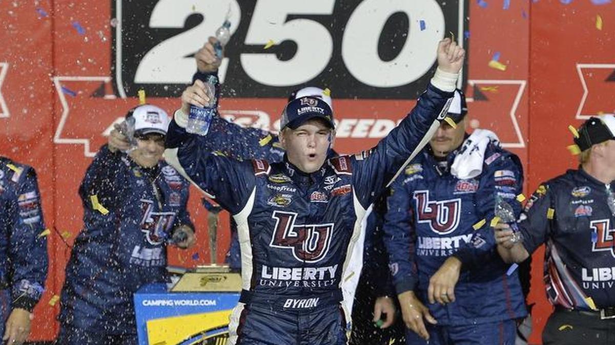 In a last lap pass in overtime, 18-year-old William Byron of Charlotte, N.C., who is still in high school, celebrates his win in the NASCAR Camping World Truck Series race with his team at Kansas Speedway Friday, May 6, 2016.
