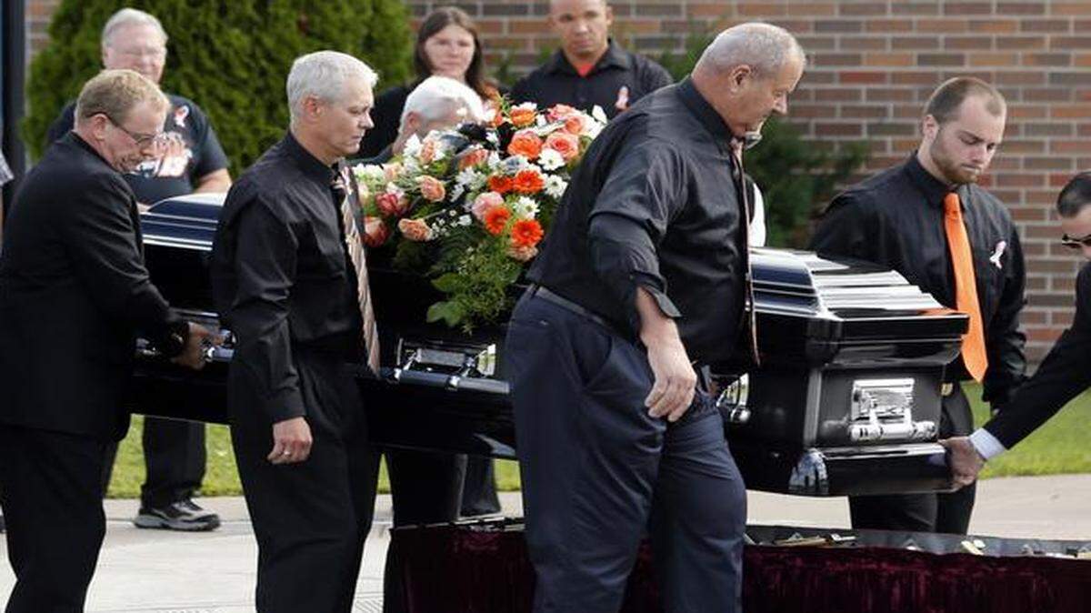 
The casket of race car driver Kevin Ward Jr., was taken from a hearse before being carried into South Lewis Central School before a funeral on Thursday in Turin, N.Y. Ward died after being struck by NASCAR driver Tony Stewart’s car during a race last weekend at a dirt track in western New York. 
