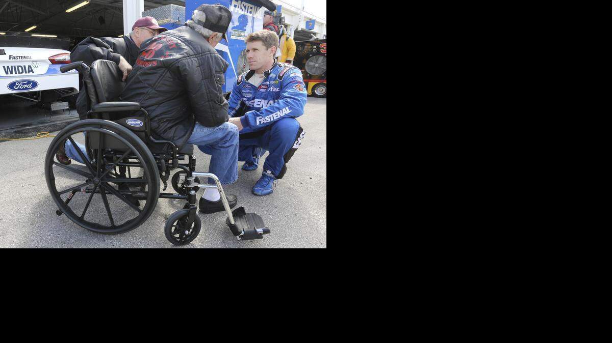 
NASCAR racer Carl Edwards (right) visited with fans on Sunday at Kansas Speedway.
