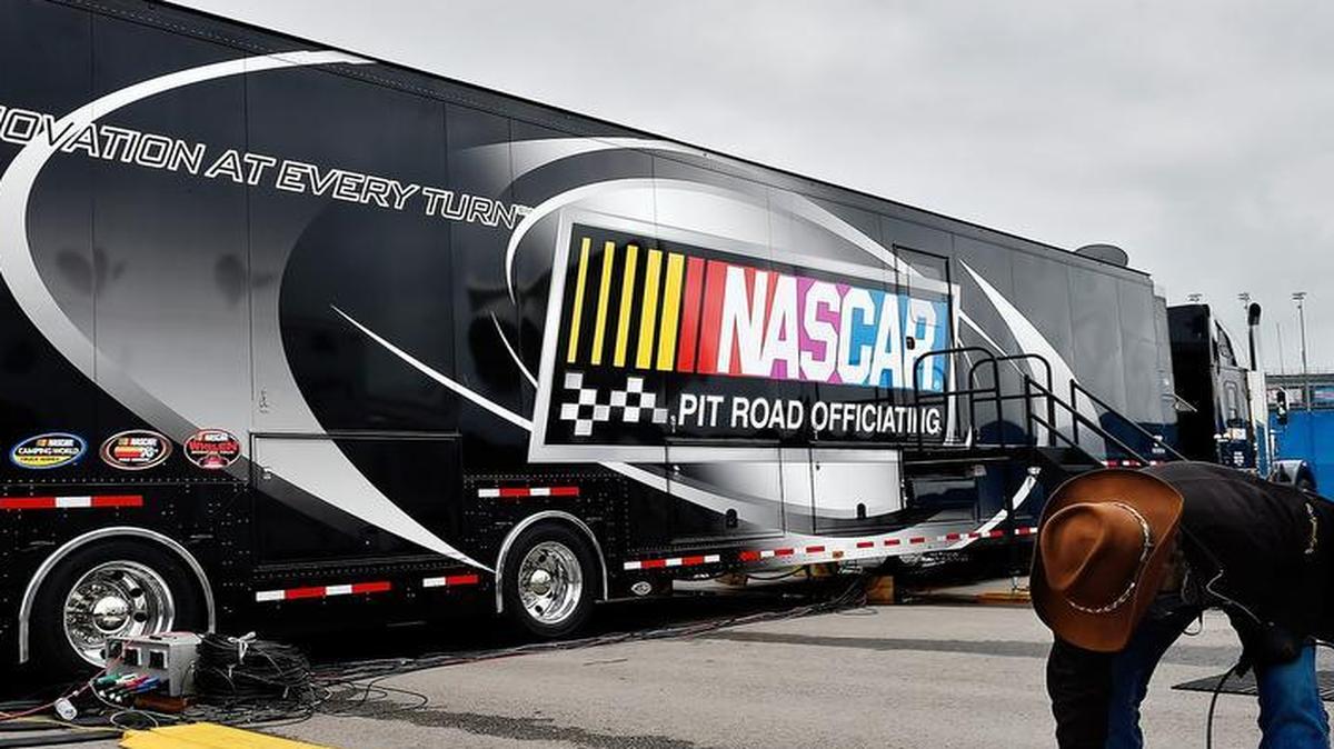 
The big, black semi-trailer truck parked this weekend at Kansas Speedway is home to NASCAR’s pit-road officiating technology.
