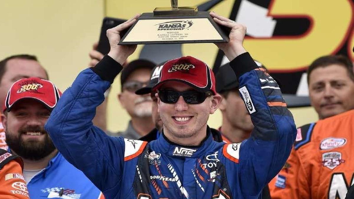 Kyle Busch raised the trophy after winning the Kansas Lottery 300 Xfinity Series race Saturday at Kansas Speedway.