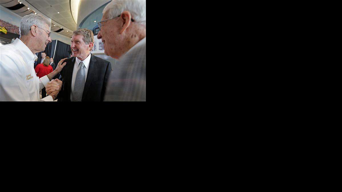 
Bill Elliott, center, is congratulated by Leonard Wood (left) and Glen Wood after being named as one of five inductees into the NASCAR Hall of Fame class of 2015 in Charlotte, N.C., on Wednesday
