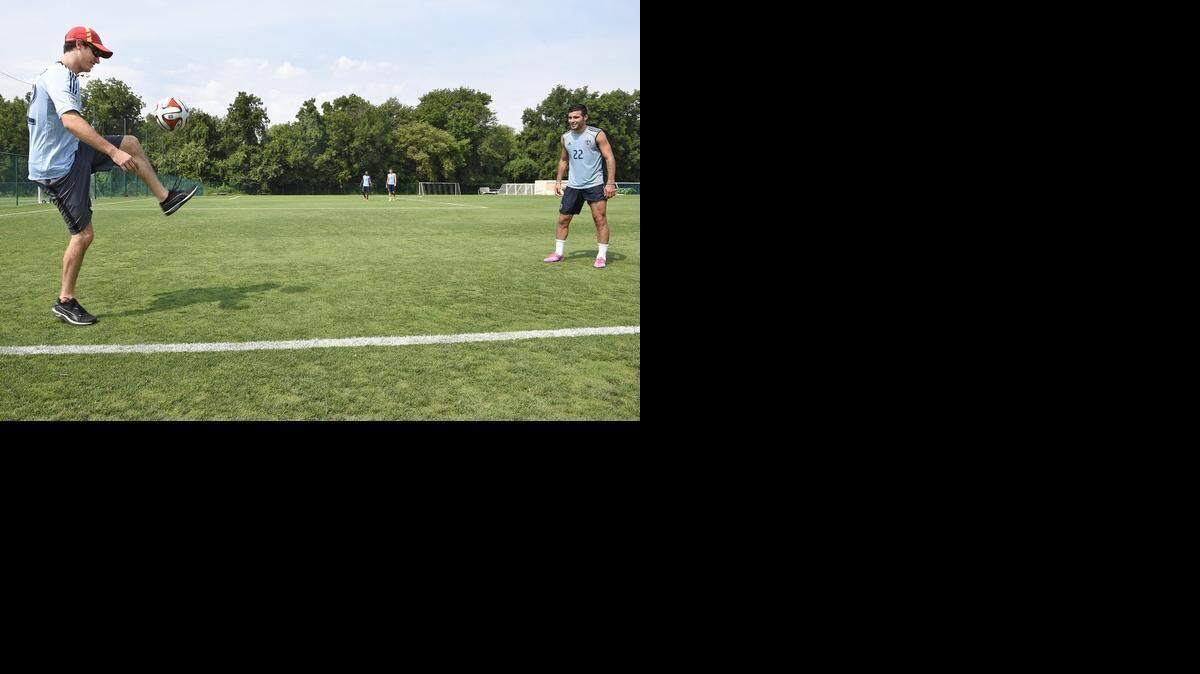 
NASCAR Sprint Cup racer Joey Logano (left) got few minutes of soccer practice in with Sporting KC’s Soony Saad during a quick visit by Logano with Sporting KC at their practice facility in Swope Park on Tuesday.
