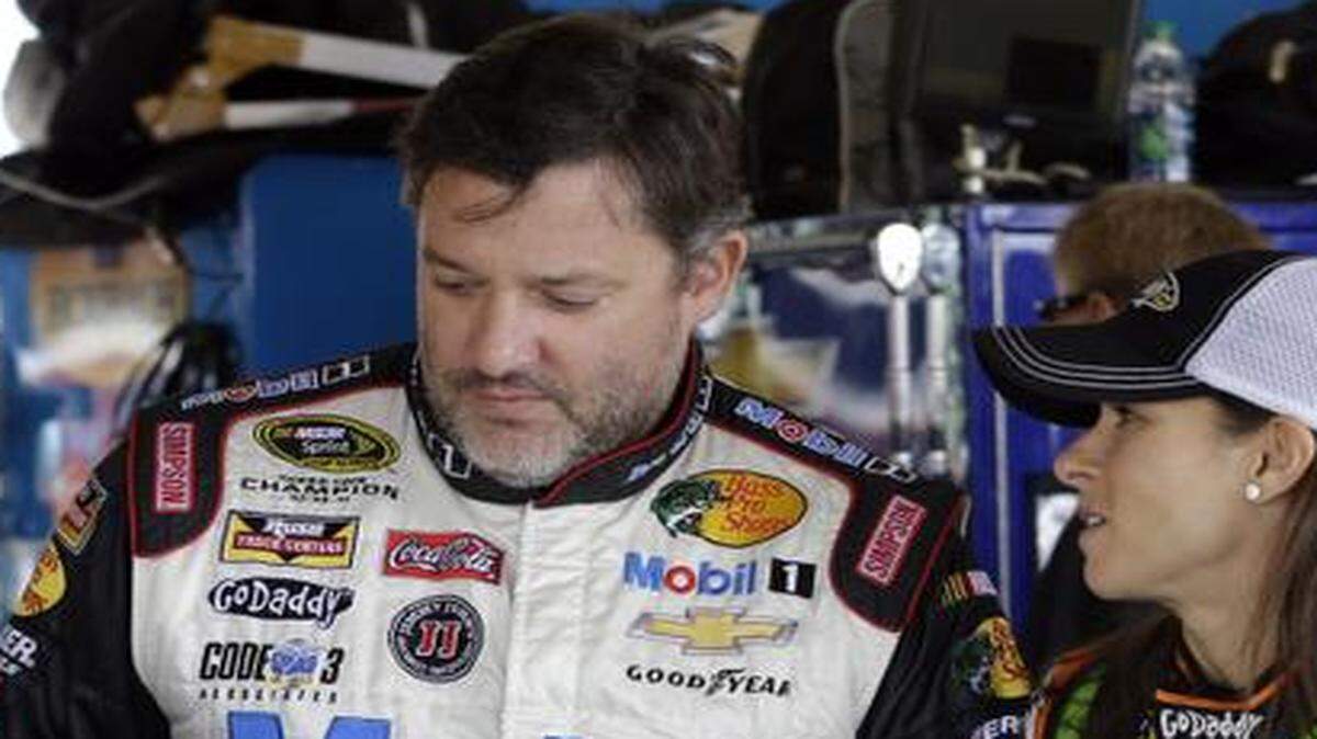 
Drivers Danica Patrick, right, and Tony Stewart talked in the garage area during final practice for the NASCAR Sprint Cup Series auto race at Chicagoland Speedway in Joliet, Ill., on Saturday.
