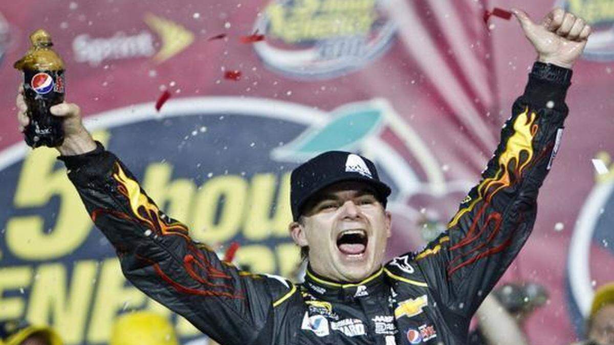 
Jeff Gordon celebrated after winning at Kansas Speedway.
