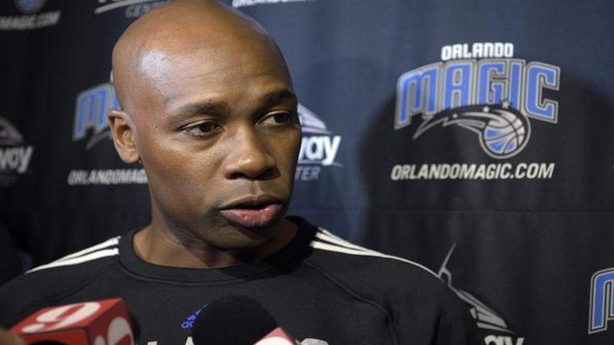 
In this Sept. 30, 2014, file photo, Orlando Magic head coach Jacque Vaughn answered questions from reporters during NBA basketball training camp practice in Orlando, Fla. 
