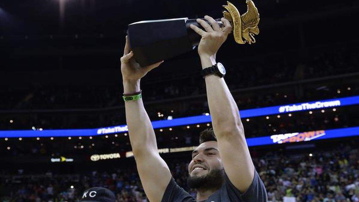 
The Miami Heat and the Golden State Warriors played Friday night, Oct. 17, 2014, at the Sprint Center. Royals players attended the game including Eric Hosmer who held the American League Championship trophy aloft during a break in the action.
