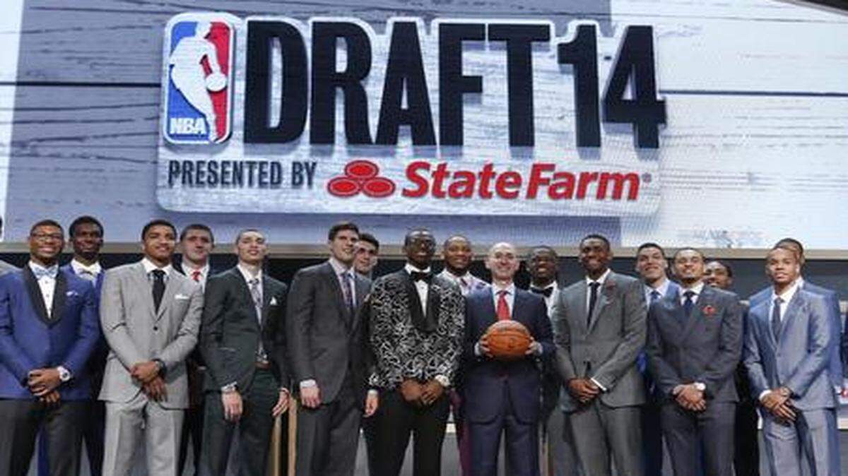 
NBA commissioner Adam Silver (center) poses for a photo with top NBA Draft prospects, including KU’s Andrew Wiggions immediately to his left, before the start of Thursday’s 2014 NBA Draft in New York. 
