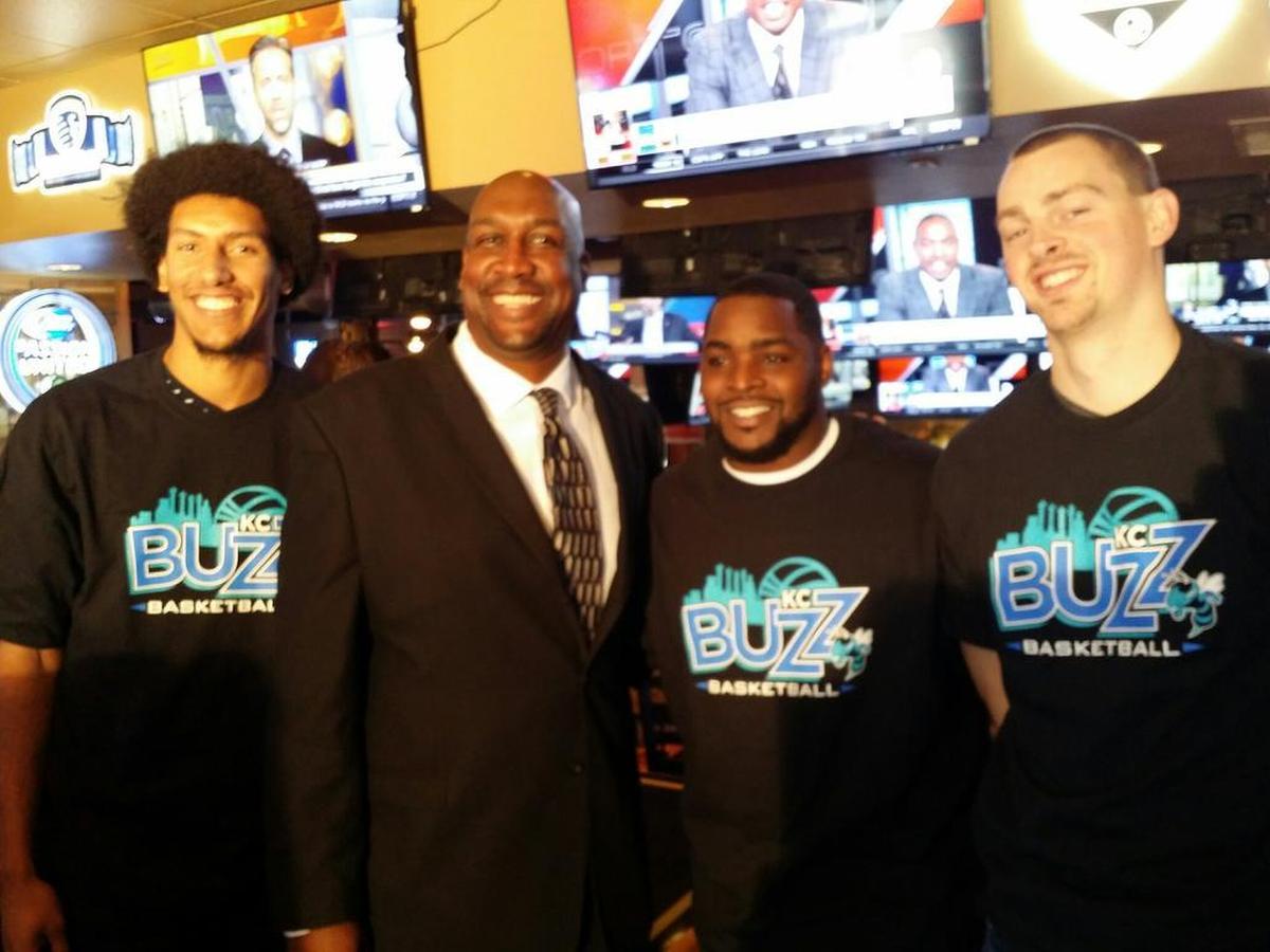 KC Buzz players (from left) Kevin Young, Sherron Collins and Jacob French of MidAmerica Nazarene pose with coach Calvin Thompson.
