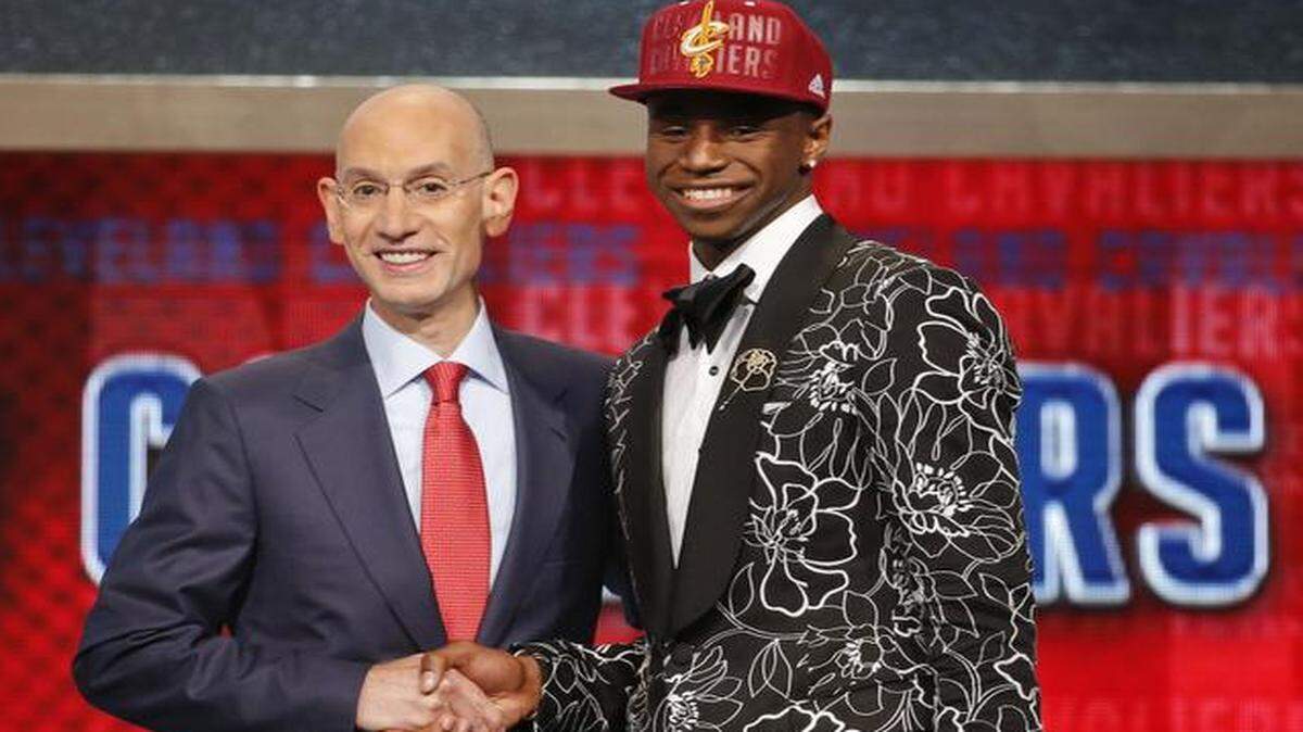 
NBA Commissioner Adam Silver congratulated Andrew Wiggins after he was selected by the Cleveland Cavaliers as the number one pick in the 2014 NBA Draft.
