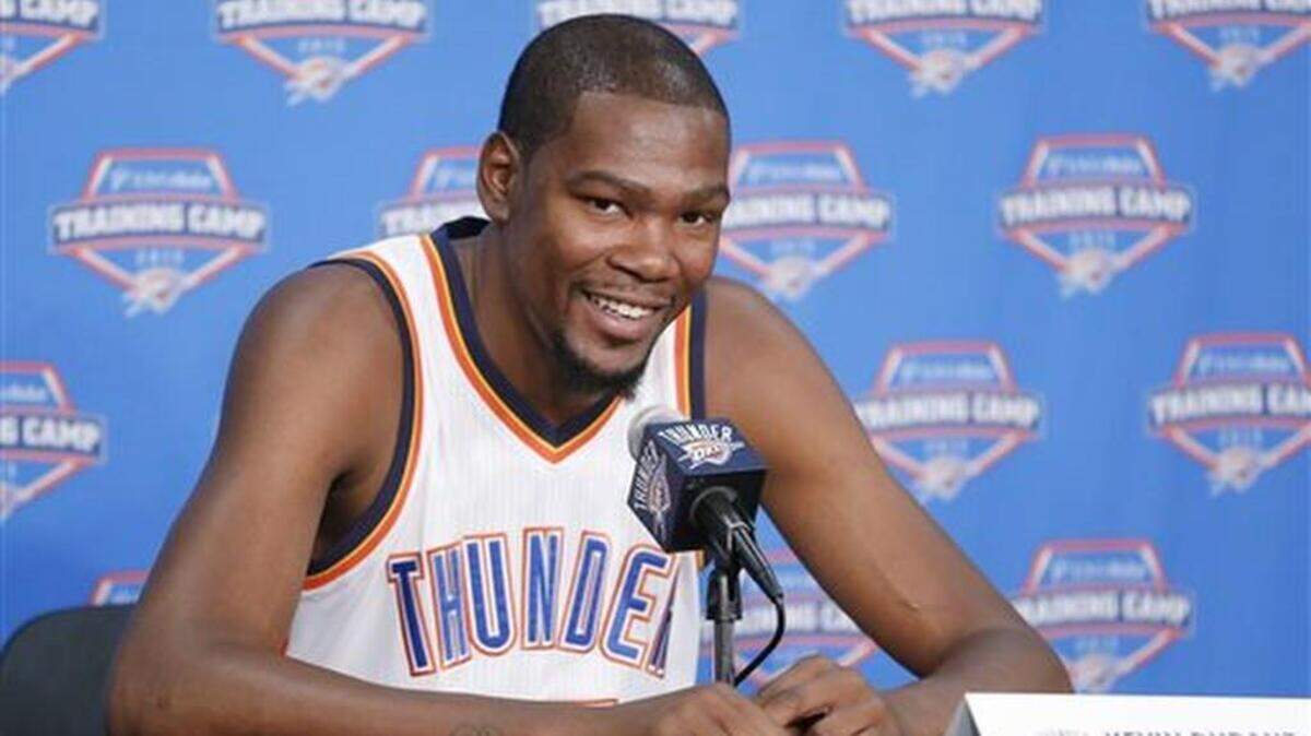 Oklahoma City Thunder forward Kevin Durant smiles as he answers a question during media day in Oklahoma City, Monday, Sept. 28, 2015.
