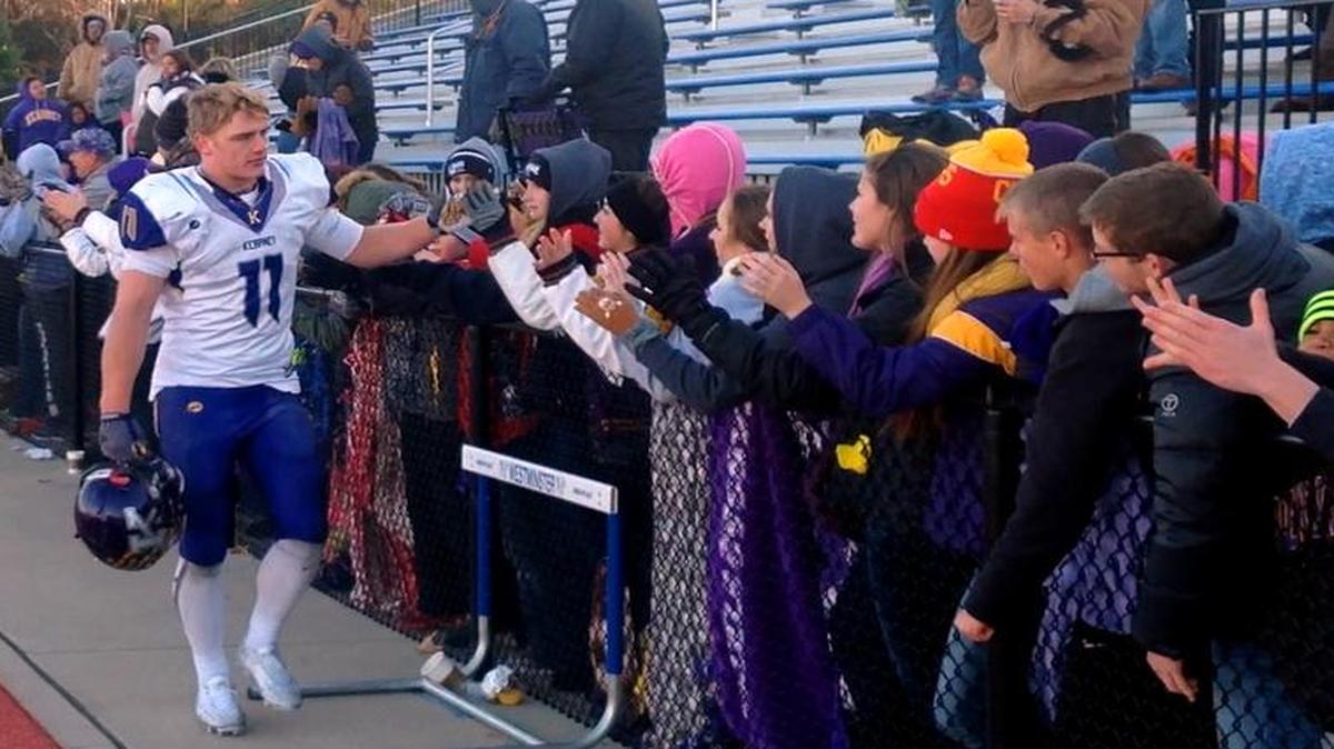 Kearney linebacker Cale Garrett celebrated with fans after the Bulldogs’ victory over Westminster Christian Academy on Saturday in Chesterfield, Mo.