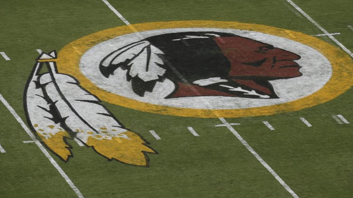 
 In this Aug. 7, 2014 file photo, Washington’s logo is seen on the field before an NFL football preseason game against the New England Patriots in Landover, Md. A federal judge has ordered the Patent and Trademark Office to cancel registration of the Washington Redskins’ trademark, ruling that the team name may be disparaging to Native Americans. 

