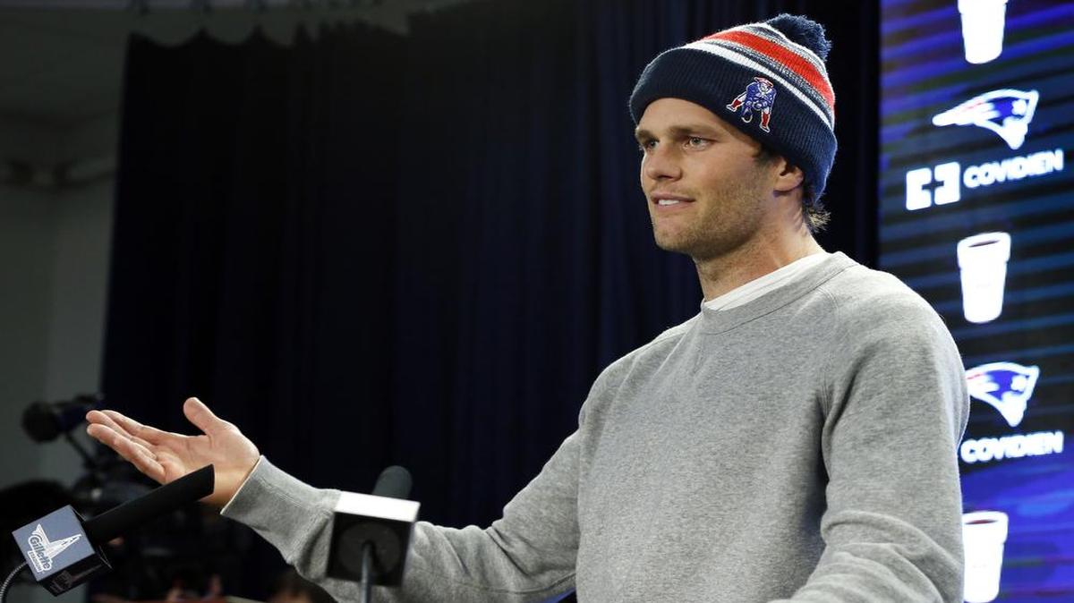 
FILE - In this Jan. 22, 2015, file photo, New England Patriots quarterback Tom Brady speaks at a news conference about the NFL investigation into deflated footballs, in Foxborough, Mass. An NFL investigation has found that New England Patriots employees likely deflated footballs and that quarterback Tom Brady was “at least generally aware” of the rules violations. The 243-page report released Wednesday, May 6, 2015, said league investigators found no evidence that coach Bill Belichick and team management knew of the practice. 
