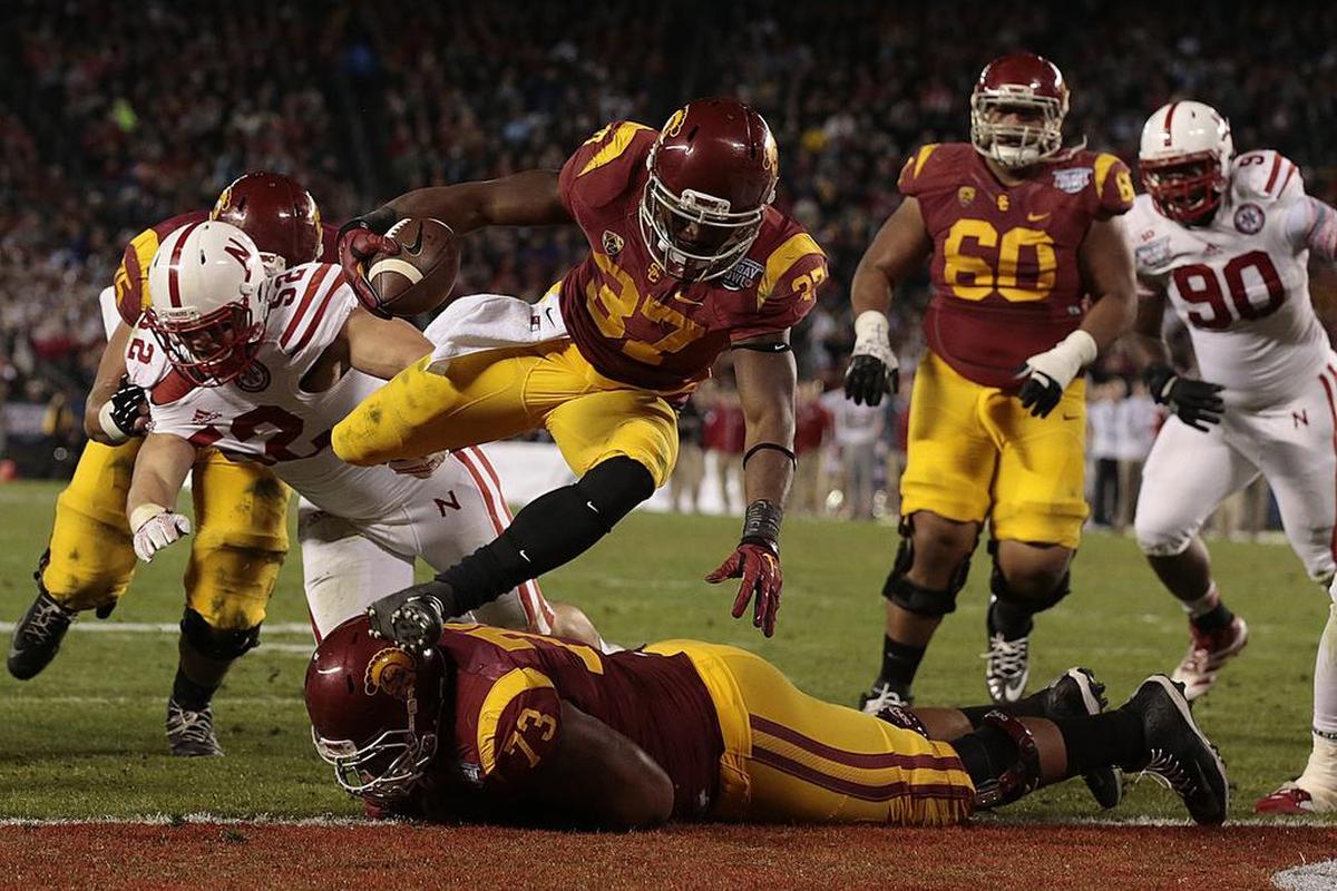 Southern California running back Javorius Allen leaped into the end zone for a second-quarter touchdown against Nebraska during the 2014 Holiday Bowl.