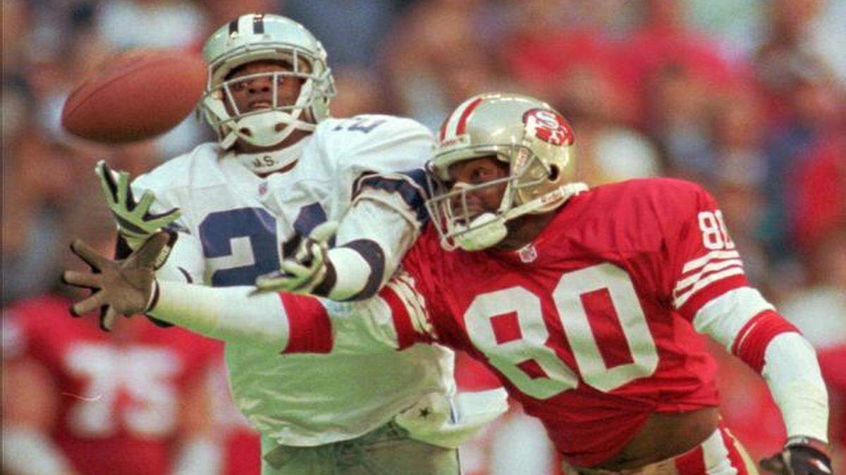 
In this Nov. 12, 1995, file photo, Dallas Cowboys defender Deion Sanders knocked the ball away from San Francisco 49ers receiver Jerry Rice.
