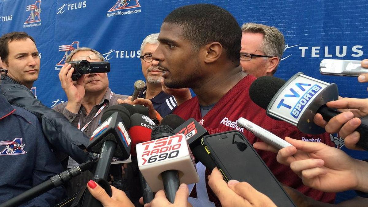 
Montreal Alouettes defensive lineman Michael Sam spoke to reporters after returning to practice with the Canadian Football League team Monday, June 29, 2015, in Montreal. Sam, the first openly gay player drafted by an NFL team, could not make the roster of the St. Louis Rams and signed with Montreal. He left the Alouettes for what he said were personal reasons, but returned to the team this week. 
