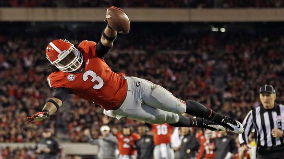 
Georgia running back Todd Gurley (3) leaped into the end zone for a touchdown against Kentucky last season
