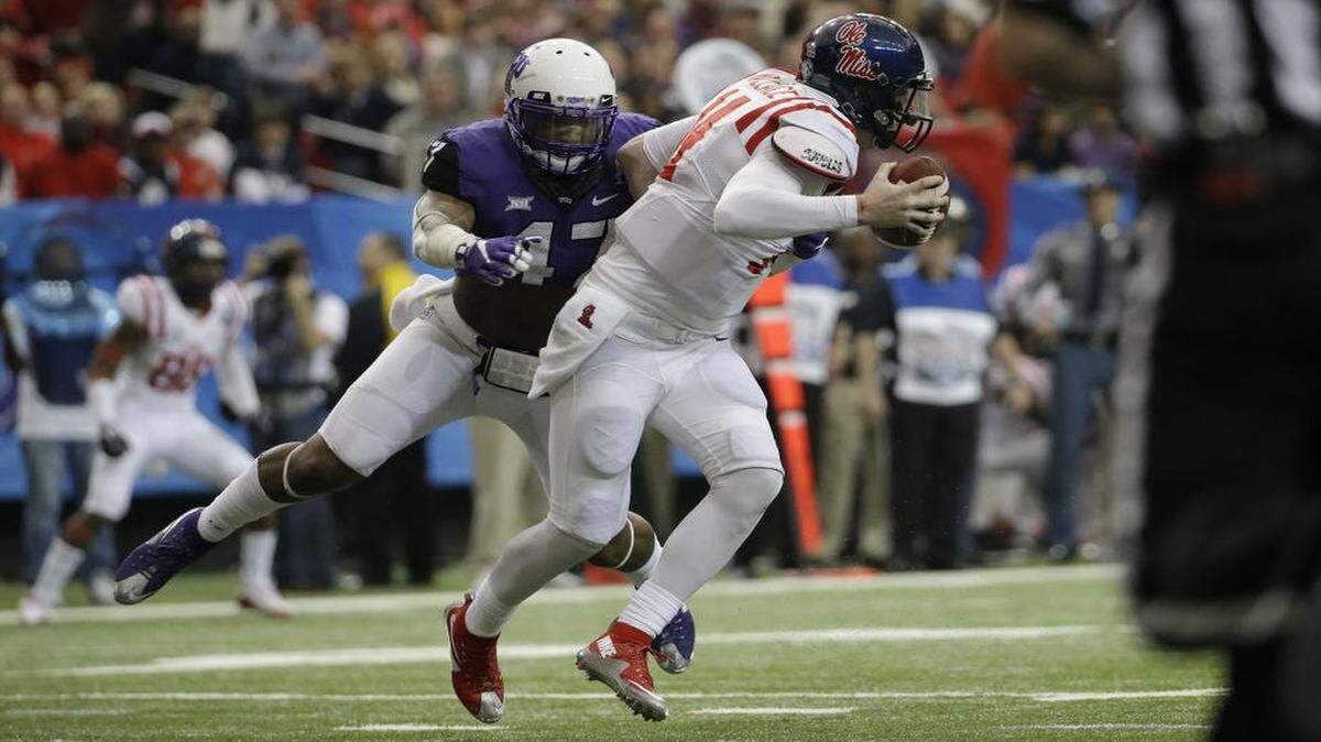 
TCU linebacker Paul Dawson hit Mississippi quarterback Bo Wallace during the Peach Bowl on Dec. 31 in Atlanta. 
