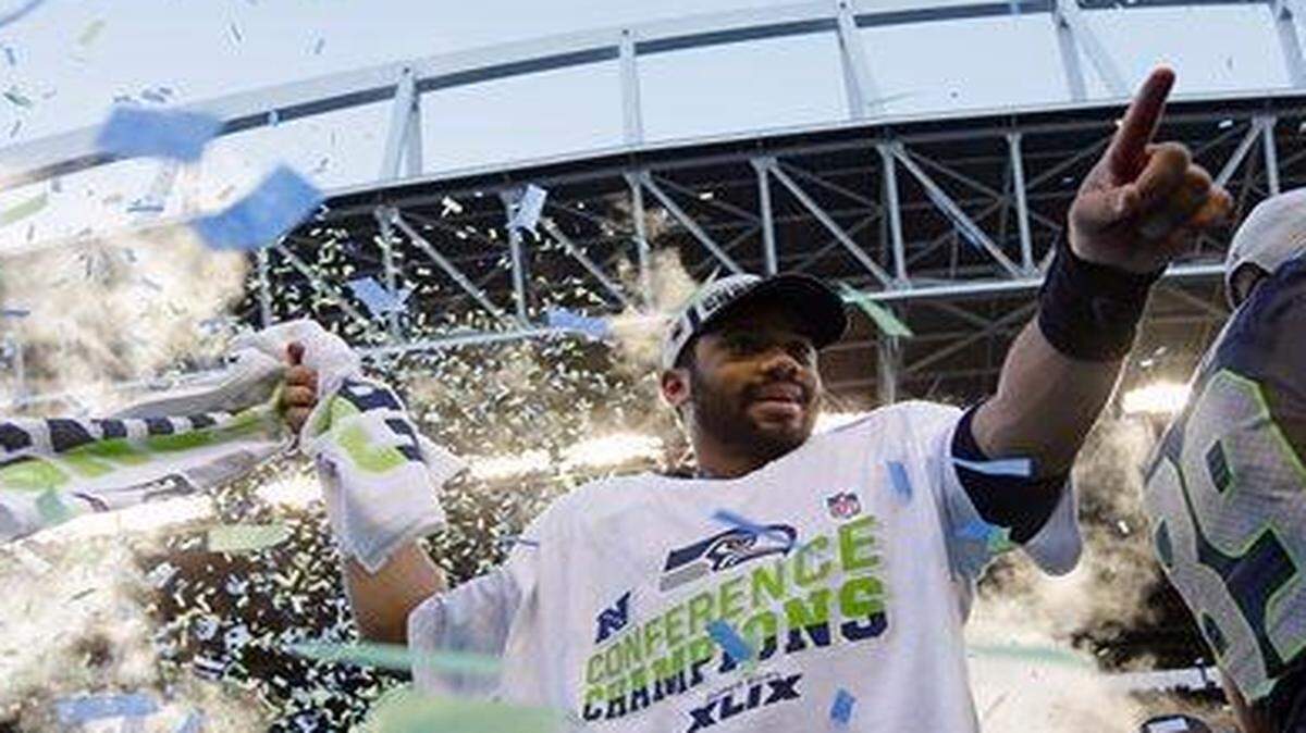 
Seattle Seahawks quarterback Russell Wilson celebrated after beating the Green Bay Packers in overtime in the NFC Championship game.
