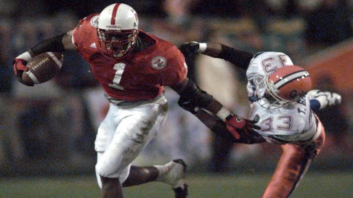 Lawrence Phillips (left) helped Nebraska to national championships after the 1994 and 1995 seasons.