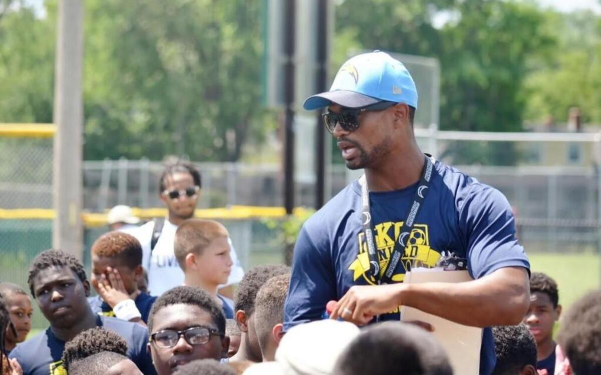 Chargers defensive back and former Kansas standout Darrell Stuckey spoke with youth football campers in 2016.
