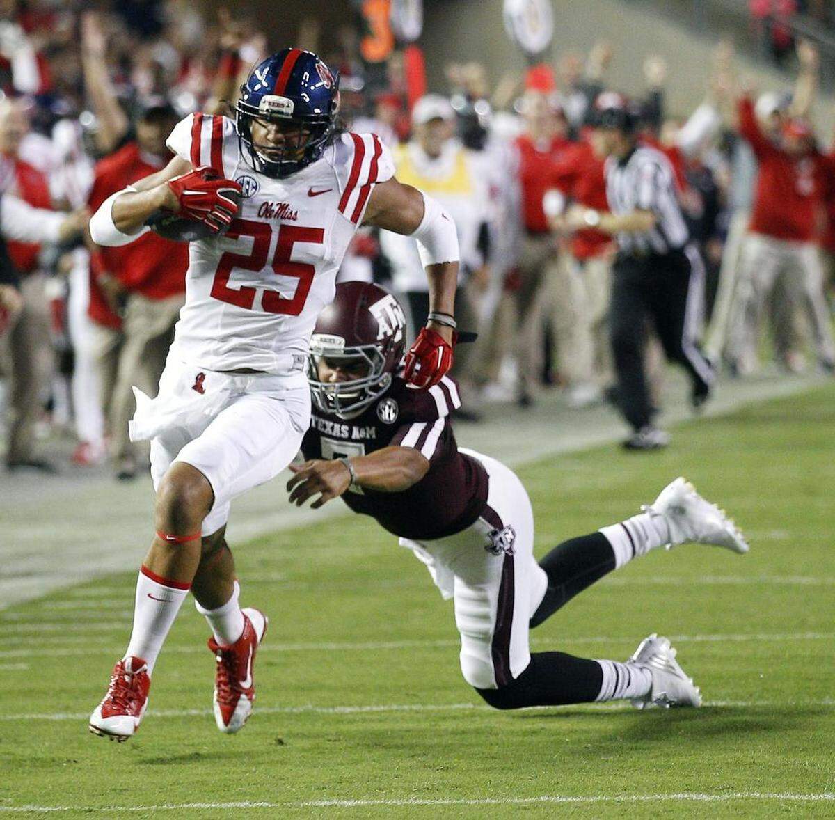 Mississippi defensive back Cody Prewitt (left) avoided a tackle by Texas A&M quarterback Kenny Hill during a 75-yard interception return for a touchdown in 2014.