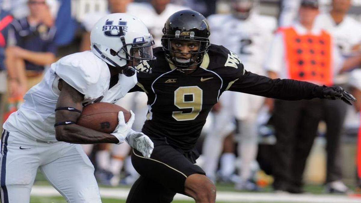 
Wake Forest cornerback Kevin Johnson closed in on Utah State receiver JoJo Natson on Sept. 13, 2014, in Logan, Utah.


