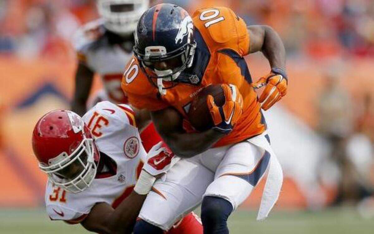 
Denver Broncos wide receiver Emmanuel Sanders was tackled by Chiefs cornerback Marcus Cooper.
