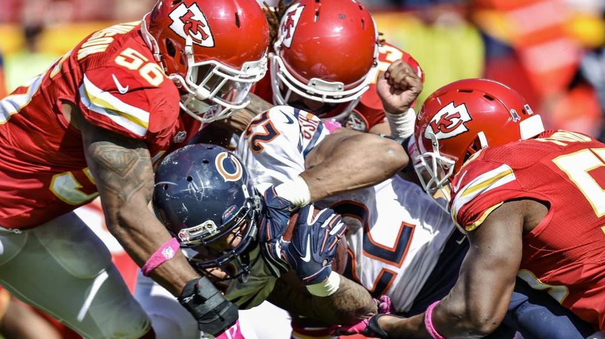 
Bears running back Matt Forte (22) was tackled by Chiefs linebackers Derrick Johnson (56), Ramik Wilson (53) and Dee Ford (55) during Sunday game at Arrowhead Stadium.
