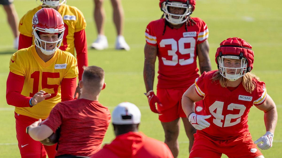 Kansas City Chiefs quarterback Patrick Mahomes (15) and running back Carson Steele (42) go through a drill together during practice at Chiefs training camp on Thursday, July 18, 2024, in St. Joseph.
