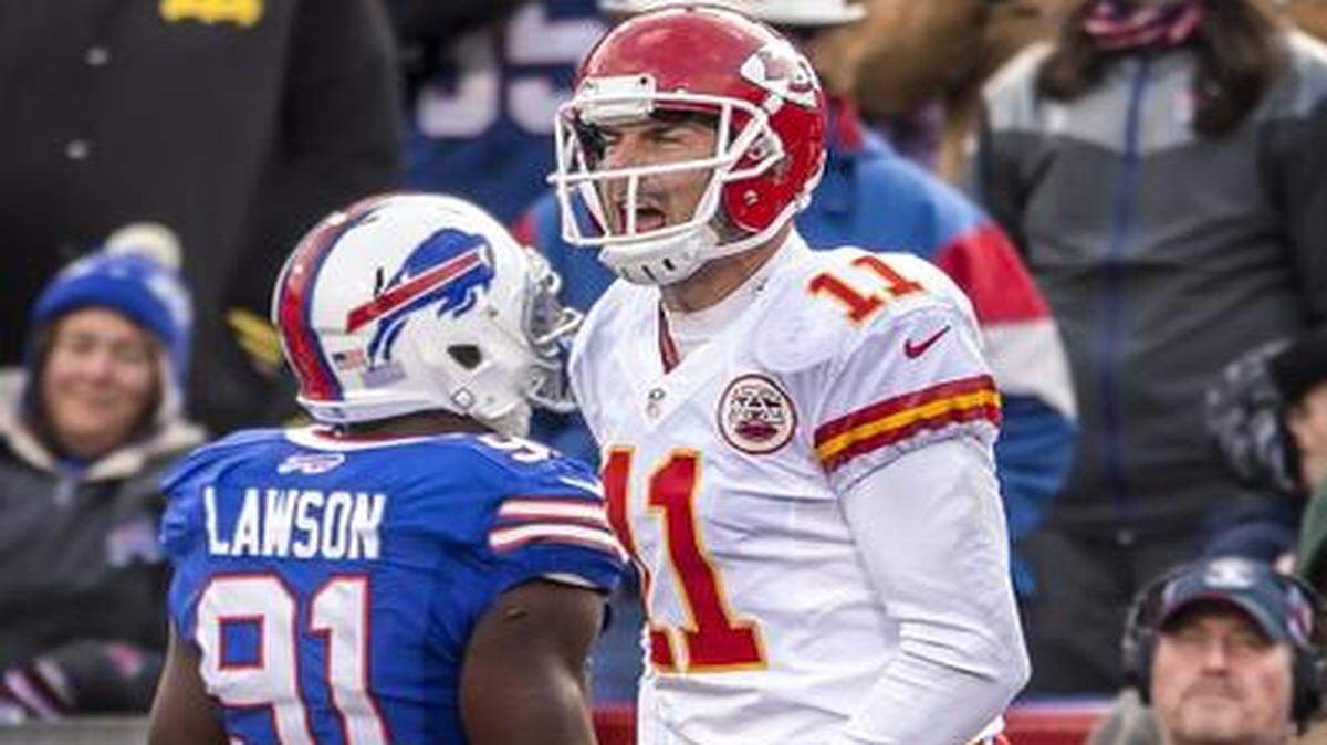 
Kansas City Chiefs quarterback Alex Smith (11) leaped up in celebration after scoring the winning touchdown in the fourth quarter past Buffalo Bills defensive end Manny Lawson (91) during NFL action on November 9, 2014 at Ralph Wilson Stadium in Orchard Park, NY. The Chiefs won 17-13.
