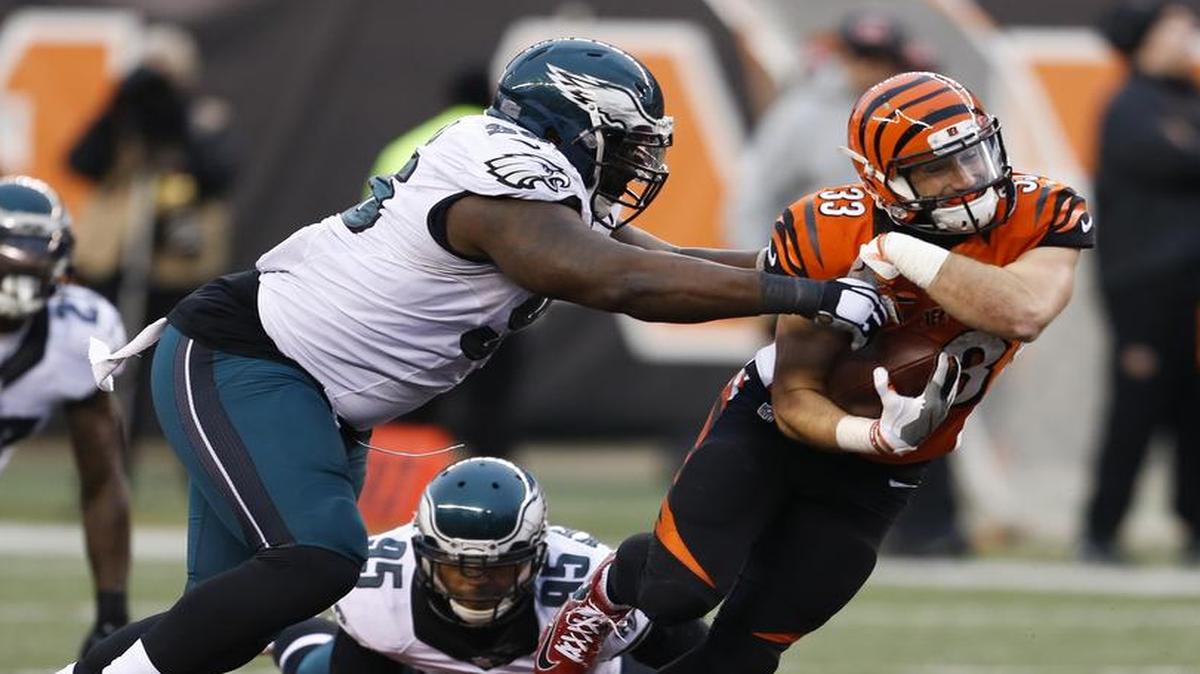 Former Philadelphia Eagles defensive tackle Bennie Logan (left) forced a fumble from Cincinnati Bengals running back Rex Burkhead during a Dec. 4, 2016 game.