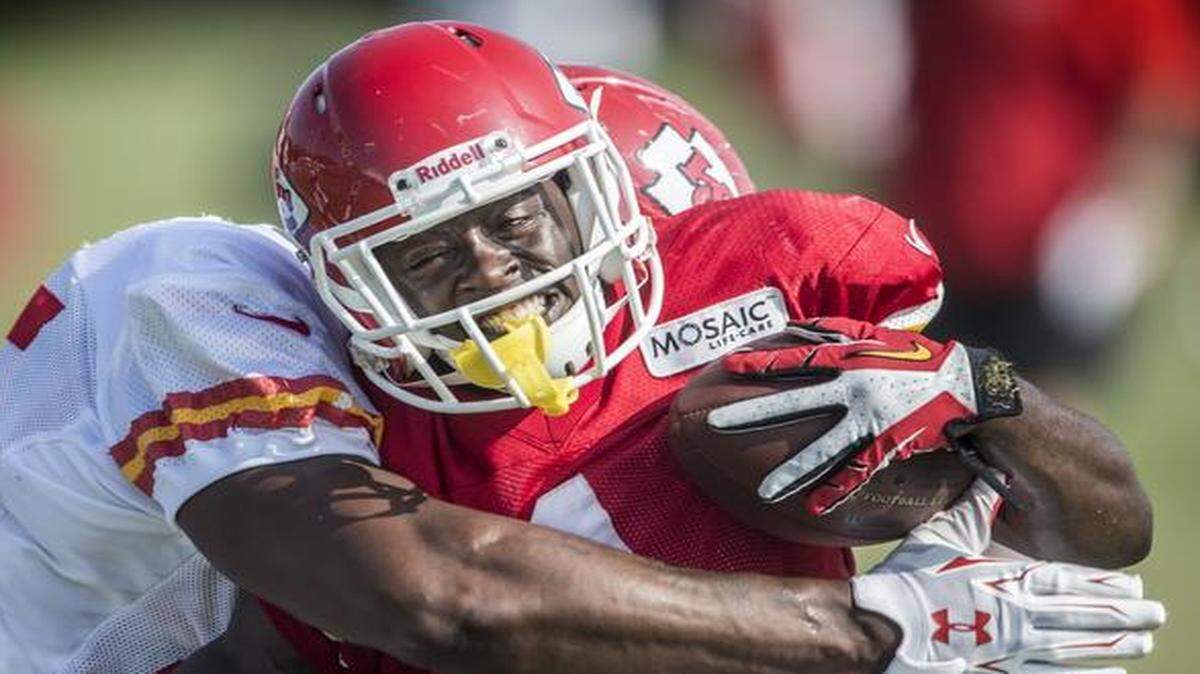 
Chiefs running back De'Anthony Thomas was tackled by linebacker Dee Ford during summer training camp practice at Missouri Western State University in St. Joseph.
