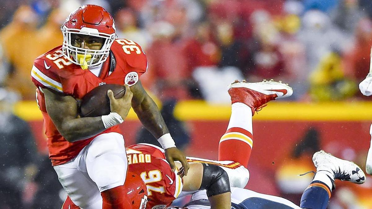 Kansas City Chiefs running back Spencer Ware (32) broke free from the Denver Broncos defense on Sunday during the first quarter at Arrowhead Stadium in Kansas City. The Chiefs defeated the Broncos 33-10.