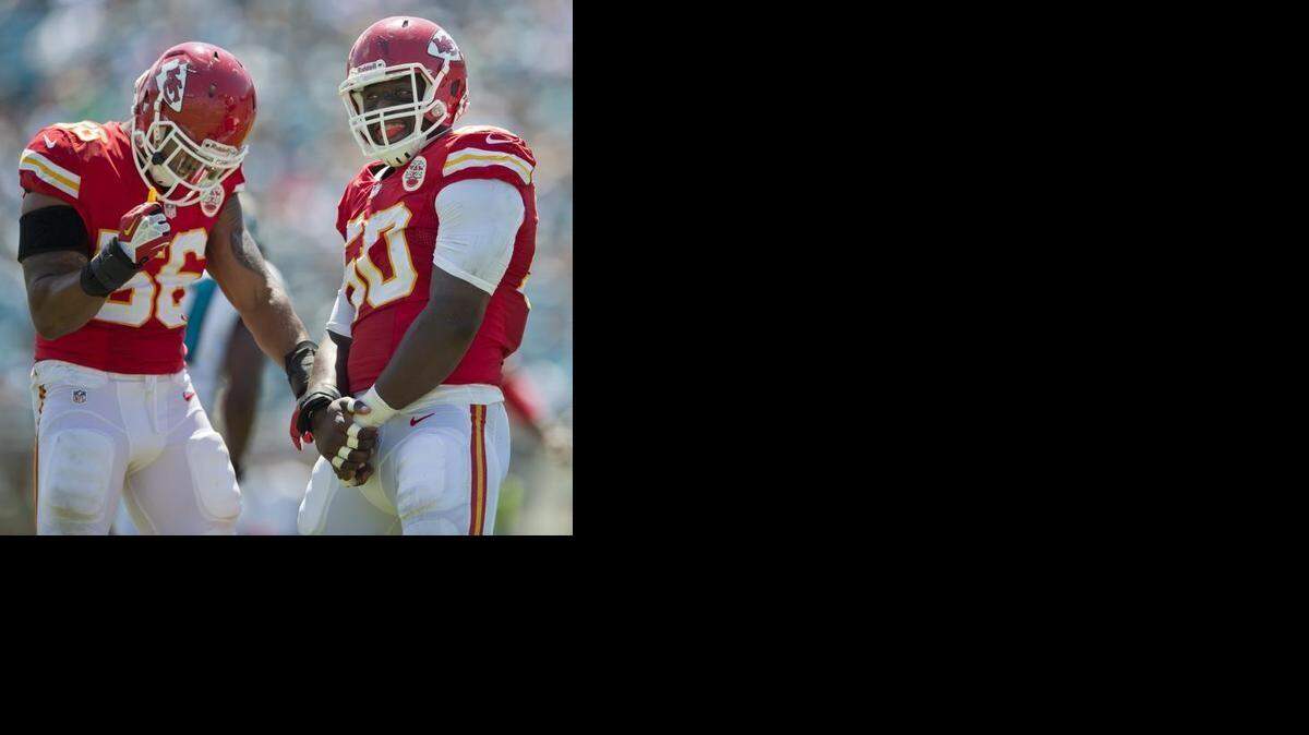 
Chiefs outside linebacker Justin Houston and cornerback Brandon Flowers were absent from organized team activities on Tuesday, but linebacker Derrick Johnson and other players didn’t seem that concerned. Johnson (56) and Houston (50) are pictured in this file photo celebrating a sack in September against the Jacksonville Jaguars.
