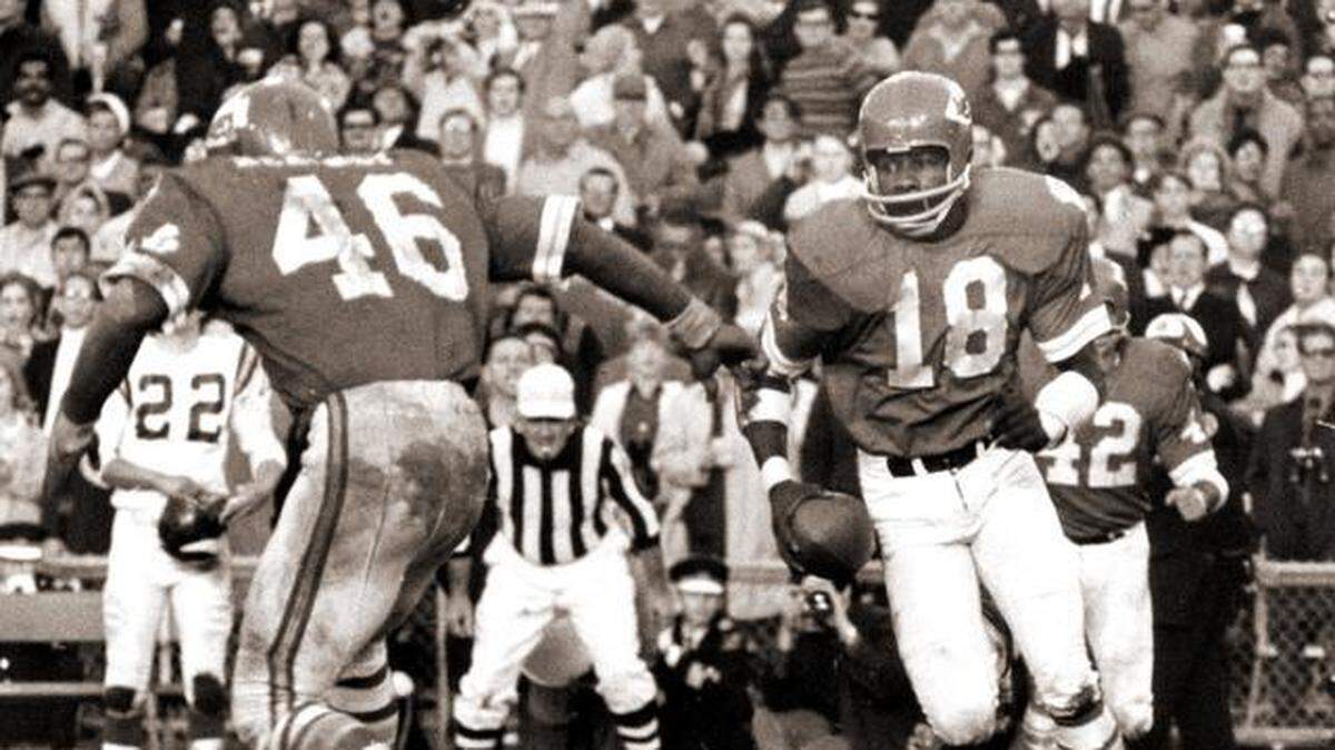 FILE: Kansas City Chiefs cornerback Emmitt Thomas (18) intercepting a pass and receiving a block by safety Jim Kearney (46) in the Chiefs 23-7 victory over the Vikings in Super Bowl IV on January 11, 1970 at Tulane Stadium in New Orleans, Louisiana.