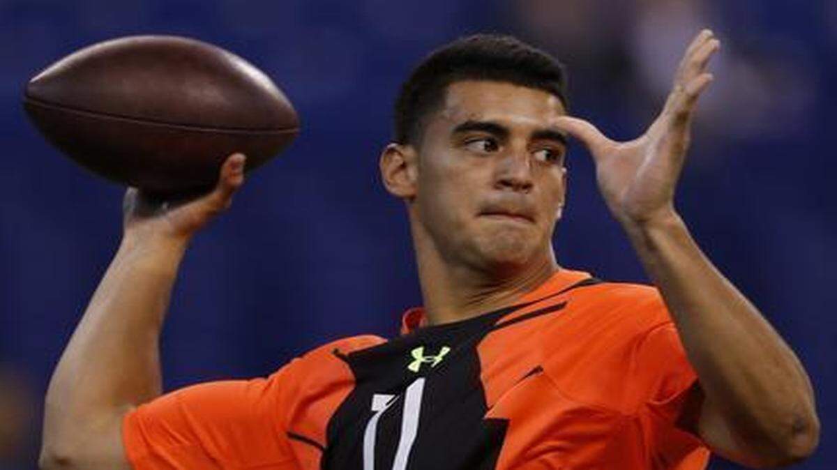 
At least one draft analyst has argued that former Oregon quarterback Marcus Mariota (pictured at last month’s NFL Combine) would be a good fit for Chiefs coach Andy Reid’s offense, and when asked about Mariota on Tuesday at the NFL’s annual meeting, Reid said that although Kansas City isn’t in a position to draft Mariota, he had heard plenty of good things about the 6-foot-4, 222 pound Heisman Trophy winner.
