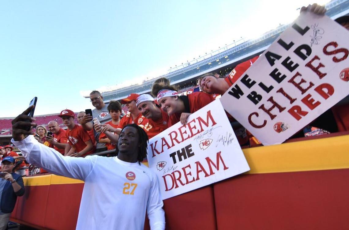 Chiefs running back Kareem Hunt poses for a picture with fans before a game against Washington on Monday, Oct. 2, 2017, at Arrowhead Stadium.