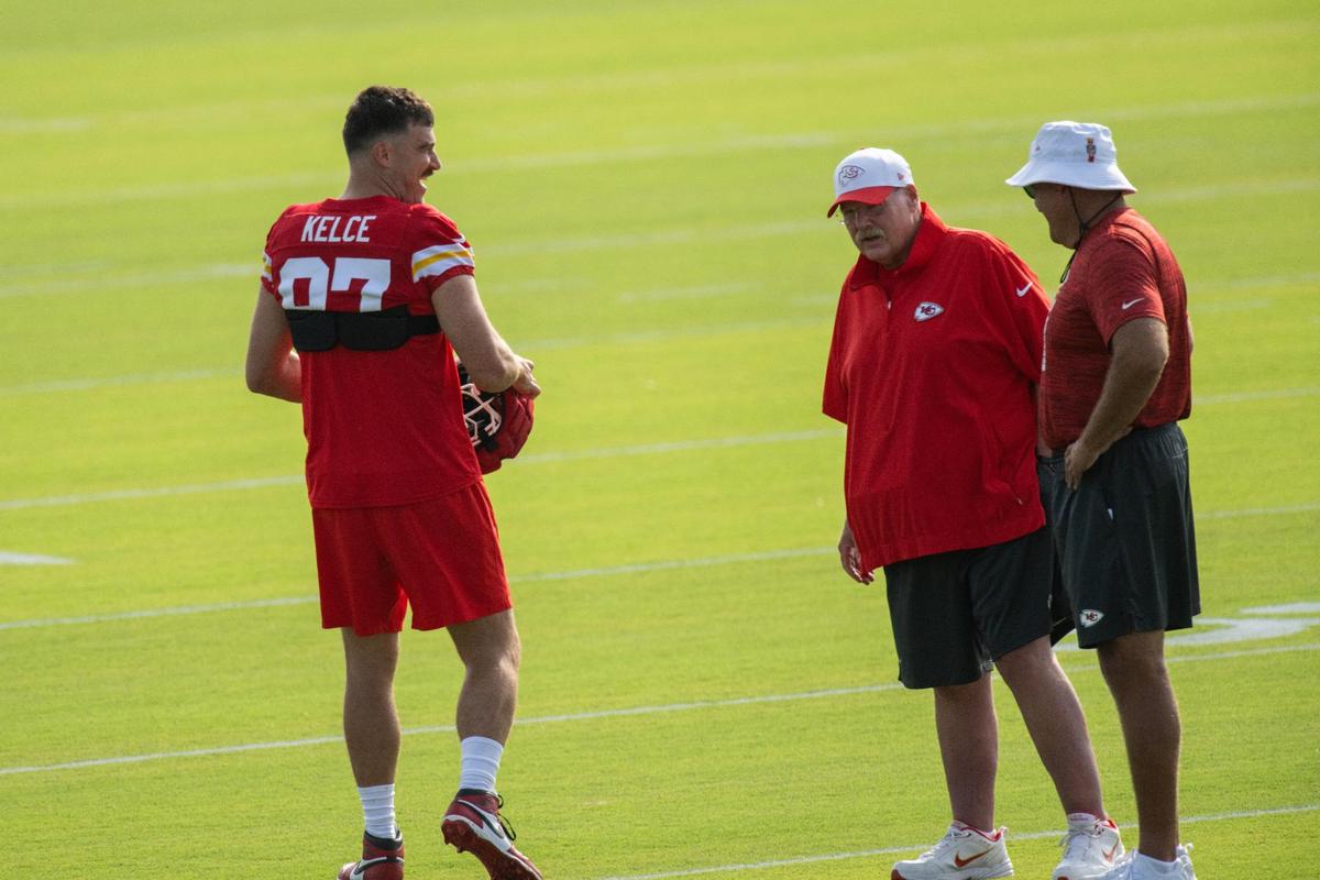 Kansas City Chiefs tight end Travis Kelce (87) and coach Andy Reid share pleasantries during training camp on Monday, July 22, 2024, in St. Joseph.