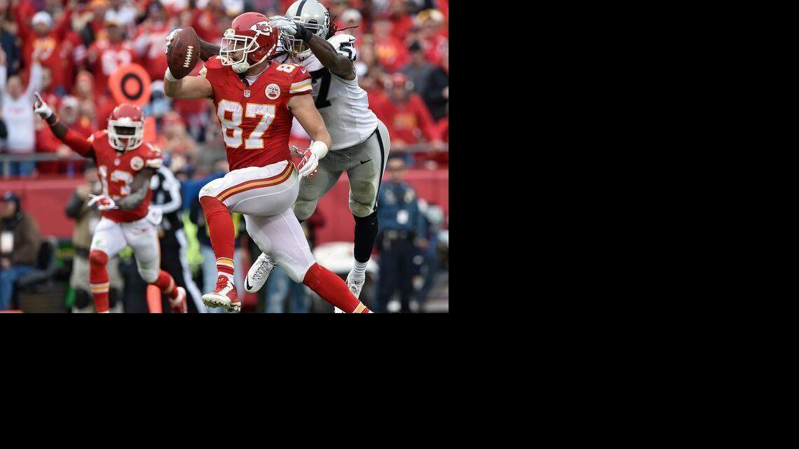 
Kansas City Chiefs tight end Travis Kelce scored a touchdown in front of Oakland Raiders linebacker Ray-Ray Armstrong (57) in the third quarter on Dec. 14, 2014, at Arrowhead Stadium.
