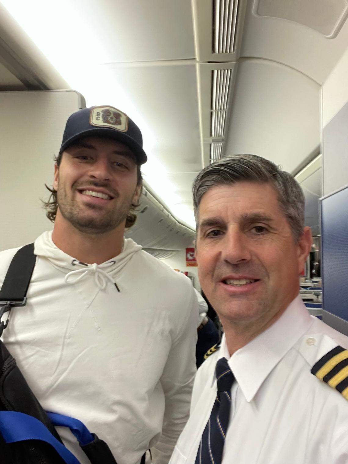Pilot Stuart Jee, right, poses for a photo with Kansas City Chiefs tight end Travis Kelce before one of the team’s charter flights.