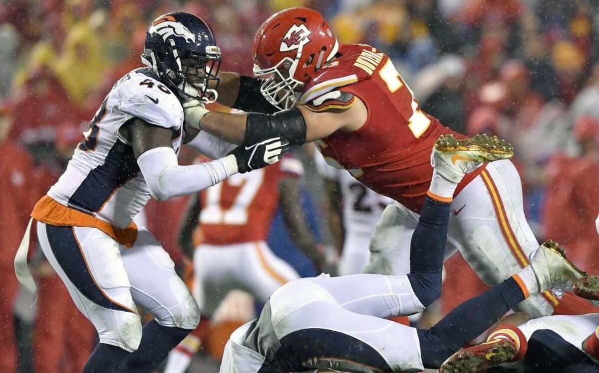 Kansas City Chiefs guard Laurent Duvernay-Tardif pushed Denver Broncos outside linebacker Shaquil Barrett away from the play during last season’s game at Arrowhead Stadium.