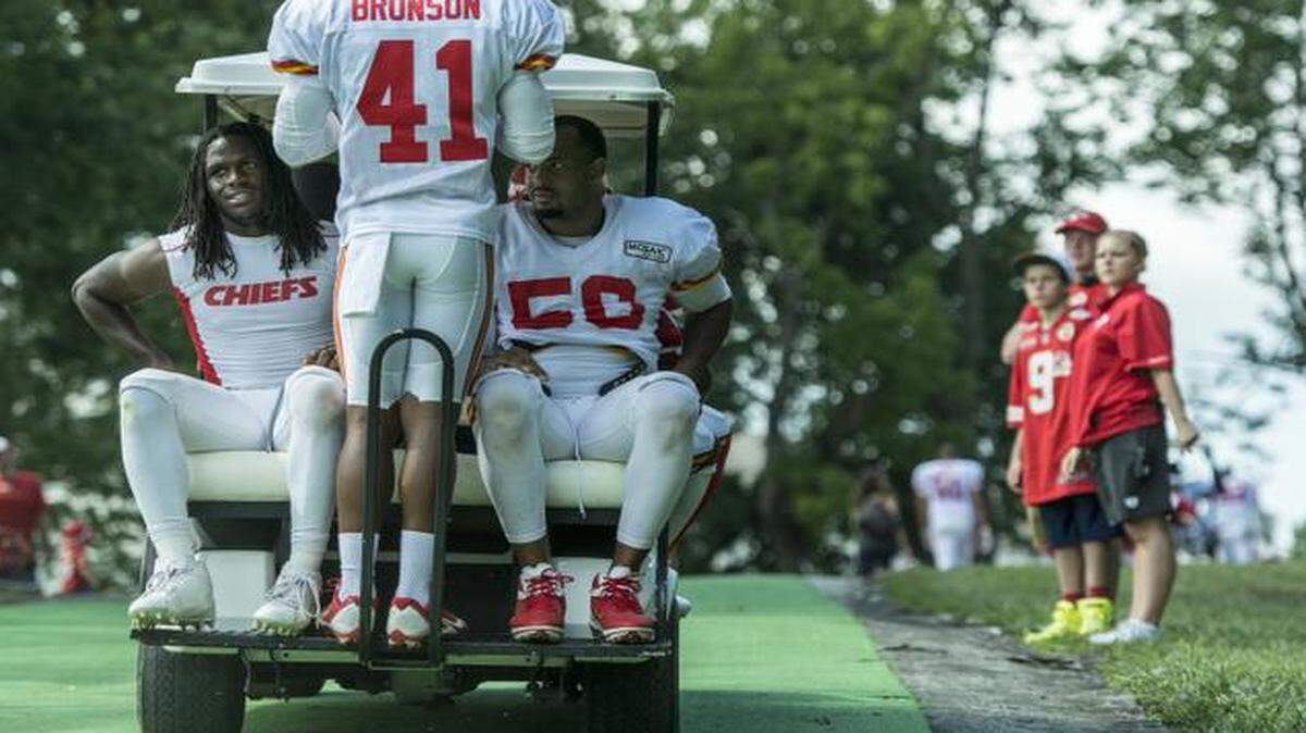 
Kansas City Chiefs running back Jamaal Charles (left) and linebacker Derrick Johnson (right), with safety Malcolm Bronson (center), hitched a golf cart ride after practice last Monday at training camp at Missouri Western State University in St. Joseph, Mo.
