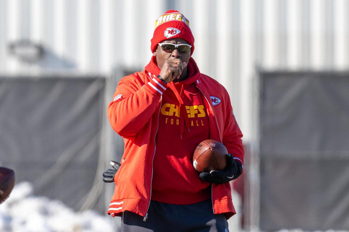 Kansas City Chiefs defensive coach Dave Merritt warms his hand before throwing a ball while performing a drill during practice at the Chiefs’ training facility on Wednesday, Jan. 15, 2025, in Kansas City.