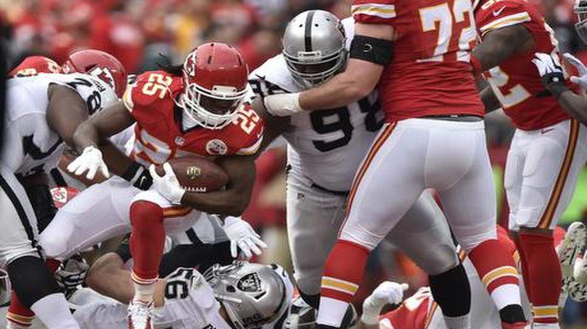 
Chiefs running back Jamaal Charles runs for a first down in the first quarter of Sunday's football game against the Raiders at Arrowhead Stadium.
