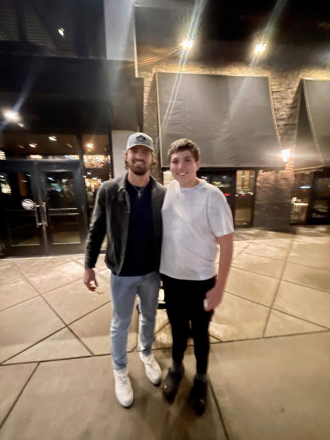 Kansas City Chiefs tight end Noah Gray, left, poses with Aiden Zepeda on Jan. 1, 2023, outside Maggiano’s restaurant in Overland Park, Kansas.