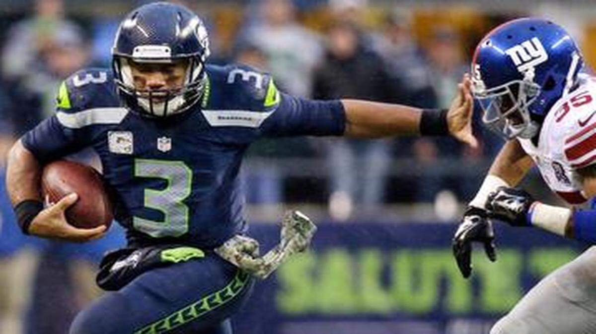 
Quarterback Russell Wilson (left) gives Seattle flexibility on offense, because he is a threat to run the ball.


